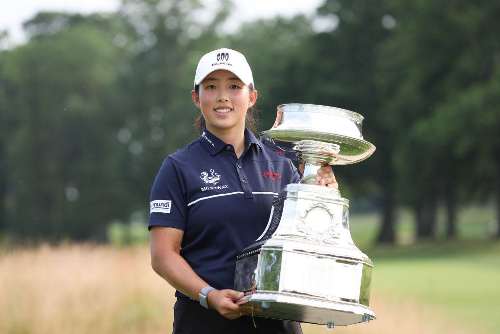Ruoning Yin poses with the Women’s PGA Championship trophy.